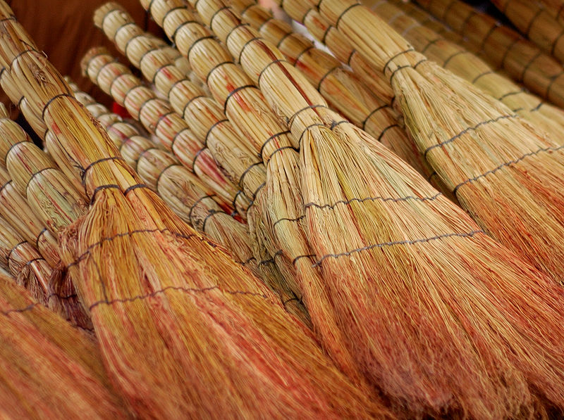 brooms stacked in a market in Tbilisi, Georgia