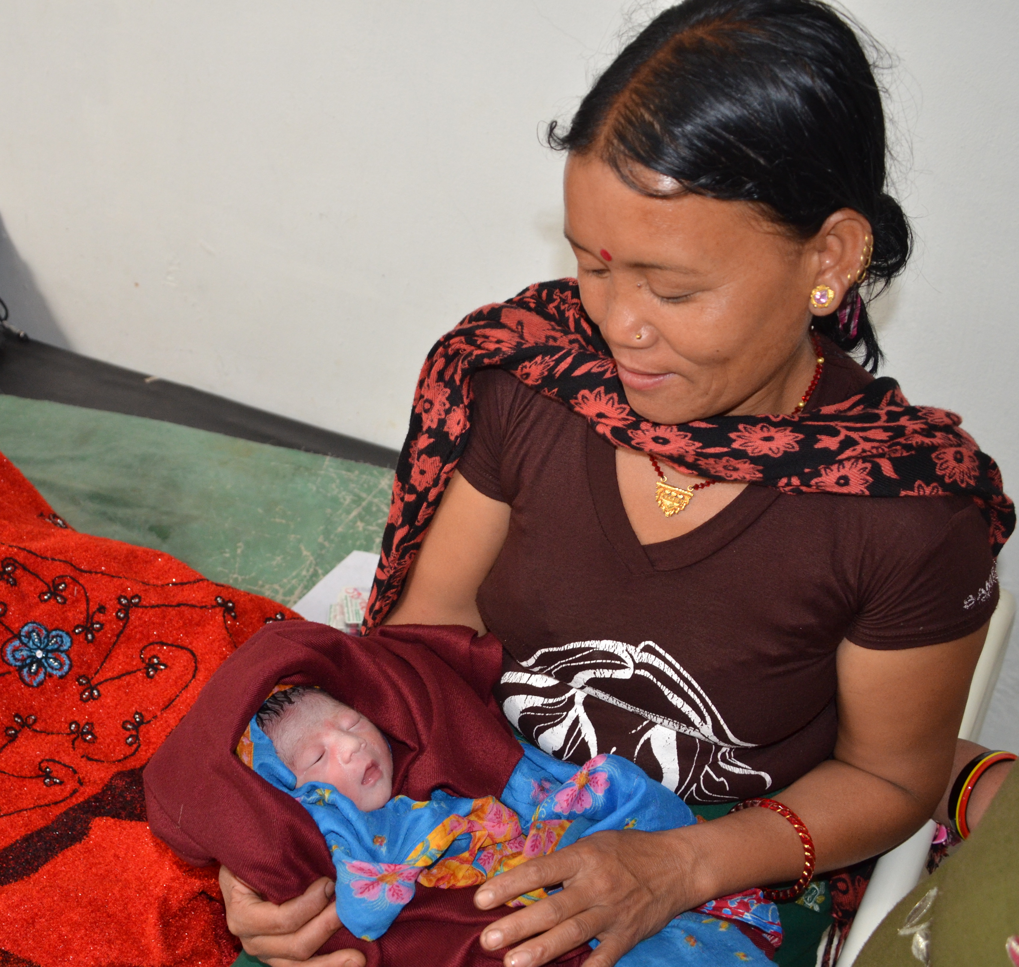 Photo of mother and child at the Primary Health Center at Thacla in Nepal.