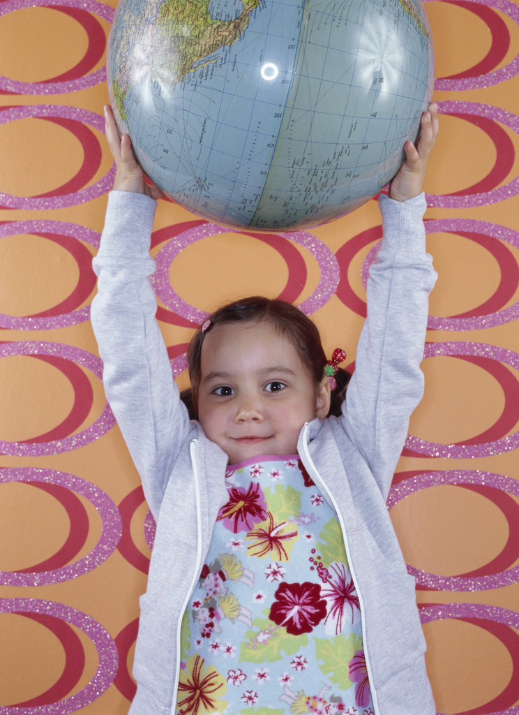 Child holding a globe